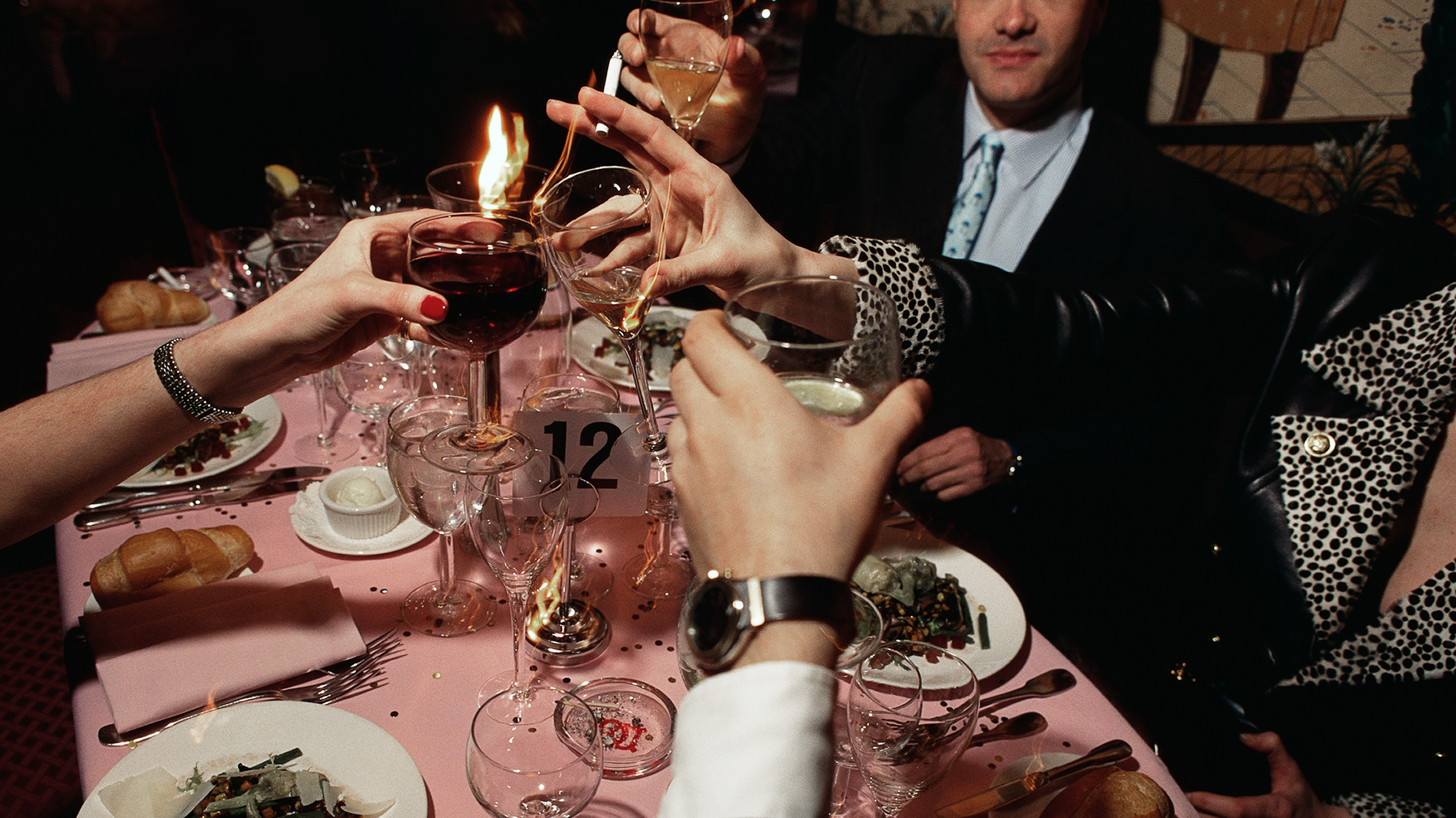 A group of people engaging in sobremesa at a table.