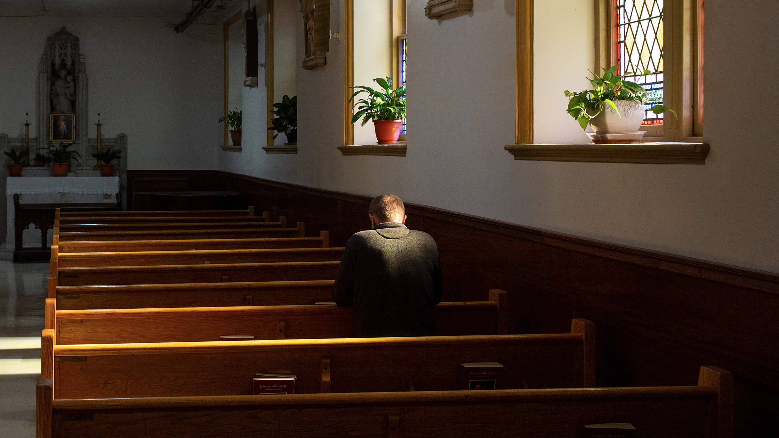 Wooden pews in a church provide a traditional seating option for parishioners.